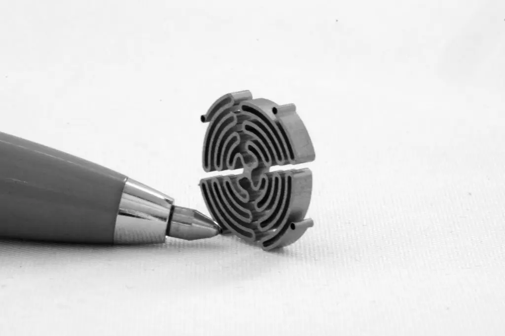 Miniature medical component produced with precision non-thermal cutting